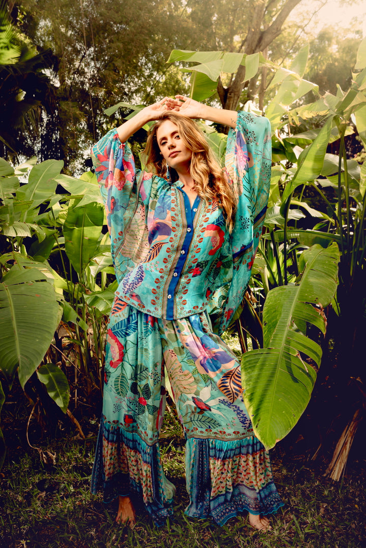 Model wearing Paul Ropp tropical collection — inspired by Earth, Fire, Water, and Forest color stories
